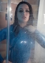 Bianka in sexy tight blue latex gets hard and horny on the shower